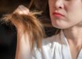 A girl is worried about her hair density.