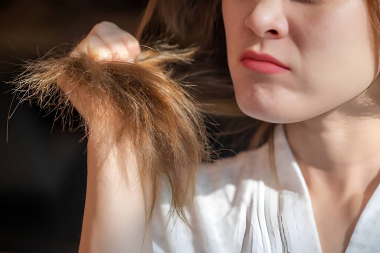 A girl is worried about her hair density.