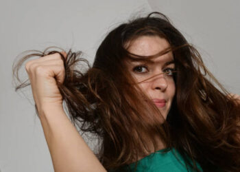 A young woman with rumpled hair