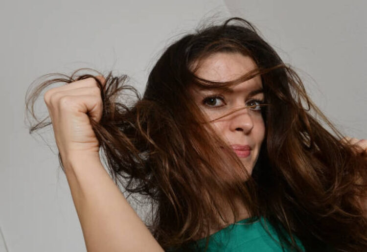 A young woman with rumpled hair