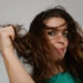 A young woman with rumpled hair