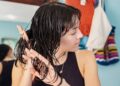 Young Woman Taking Care of her Hair at Home