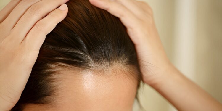 A woman has problems with hair and scalp