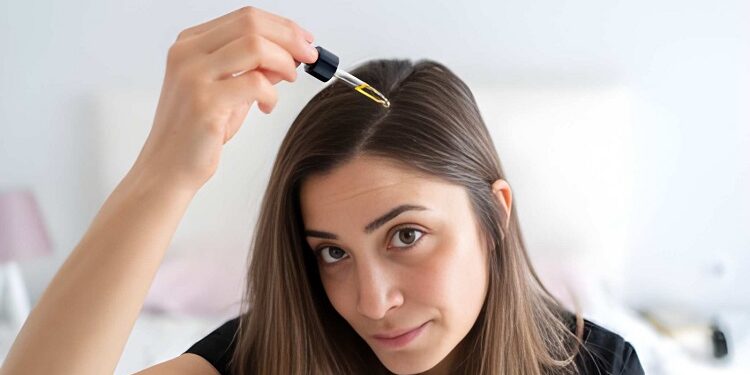 Applying Hair Serum To Her Hair